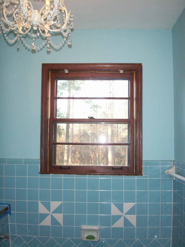 Bathroom window with stained trim. Designs by Donna Atlanta