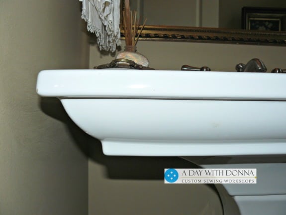 The side view of the pedestal sink shows you the lip of the sink.