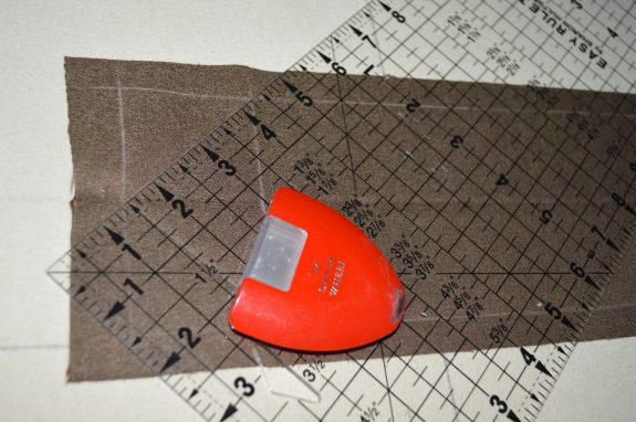 a few tools which help in making a contrast mitered flange pillow